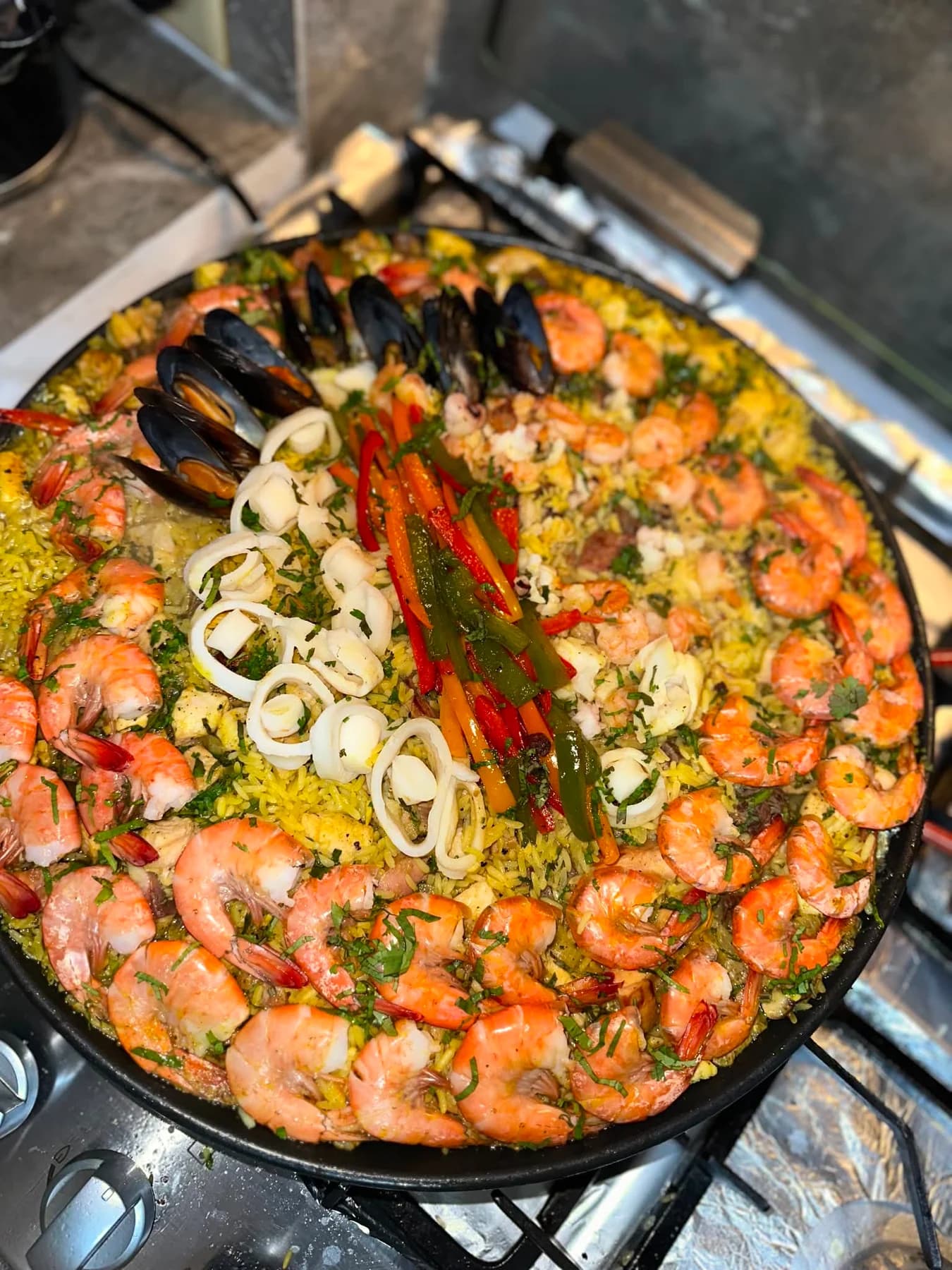 A large seafood and rice pan cooked during Sigi's hotel training in Spain.